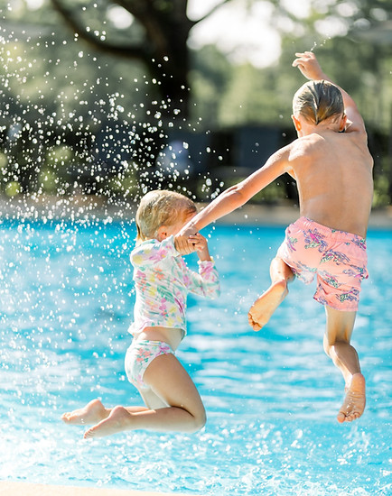 Kids jumping into pool